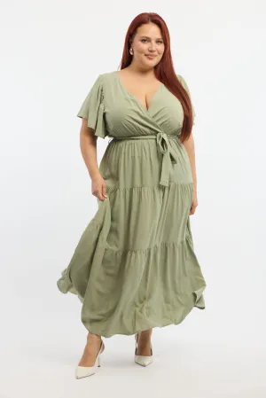 Green Tiered Maxi Dress Short Sleeve With its elegant lines this dress offers a sophisticated look that never goes out of fashion Designed with simplicity and sophistication in mind this dress is perfect for any occasion