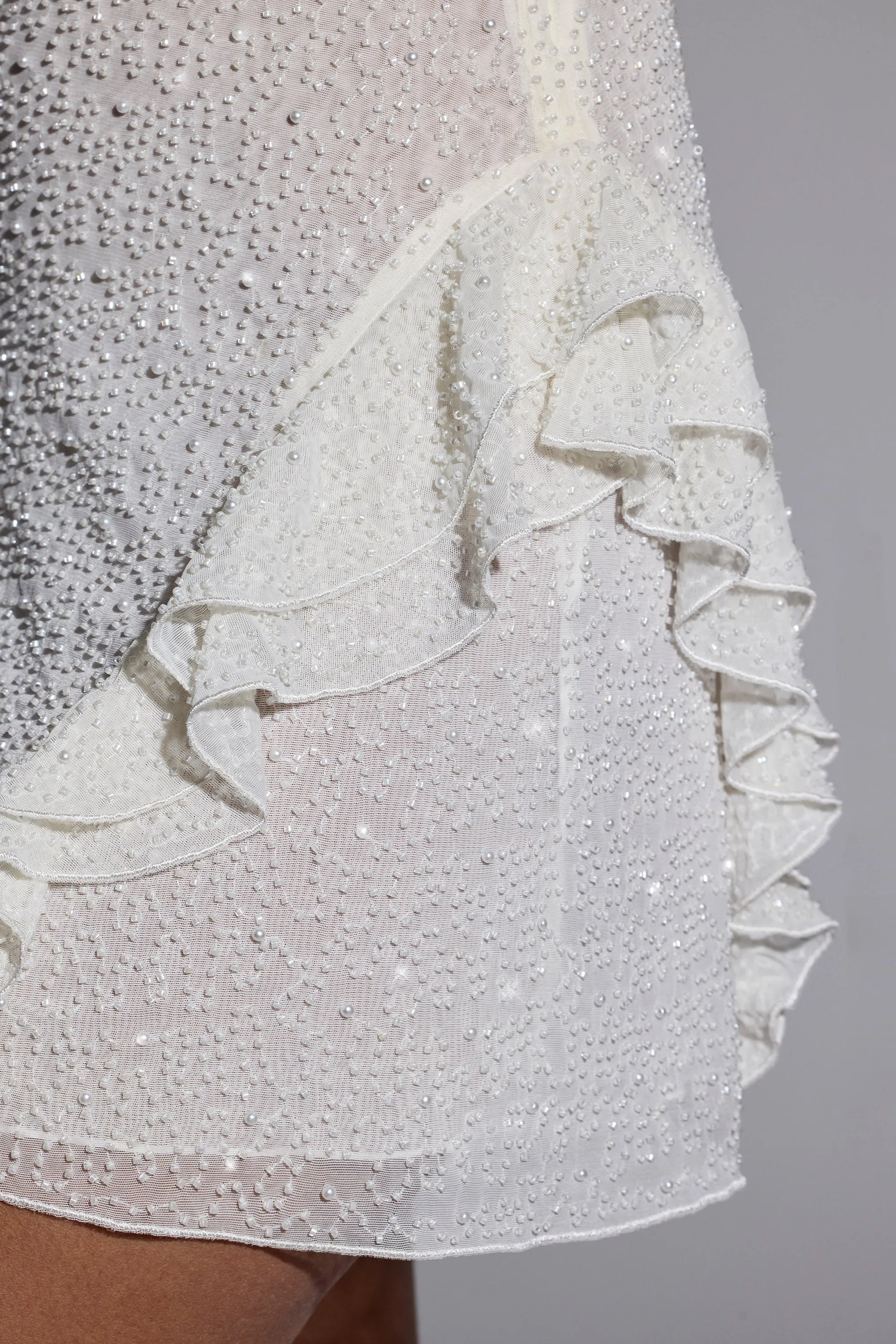 Embellished Frill Mini Dress in White Edge Glow party mode