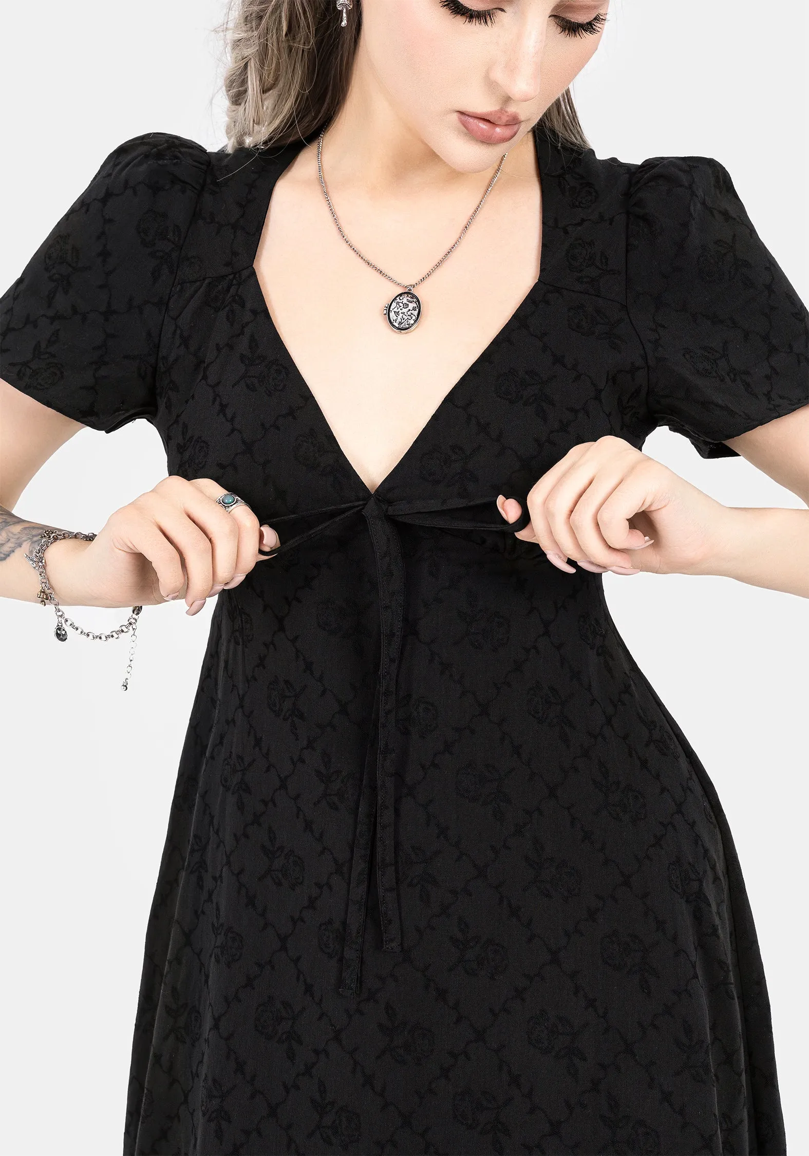 This maxi dress combines a relaxed fit with an elegant look for a versatile wardrobe piece With its flowy design this dress drapes beautifully for a sophisticated look Polgara Floral Jacquard Midaxi Dress