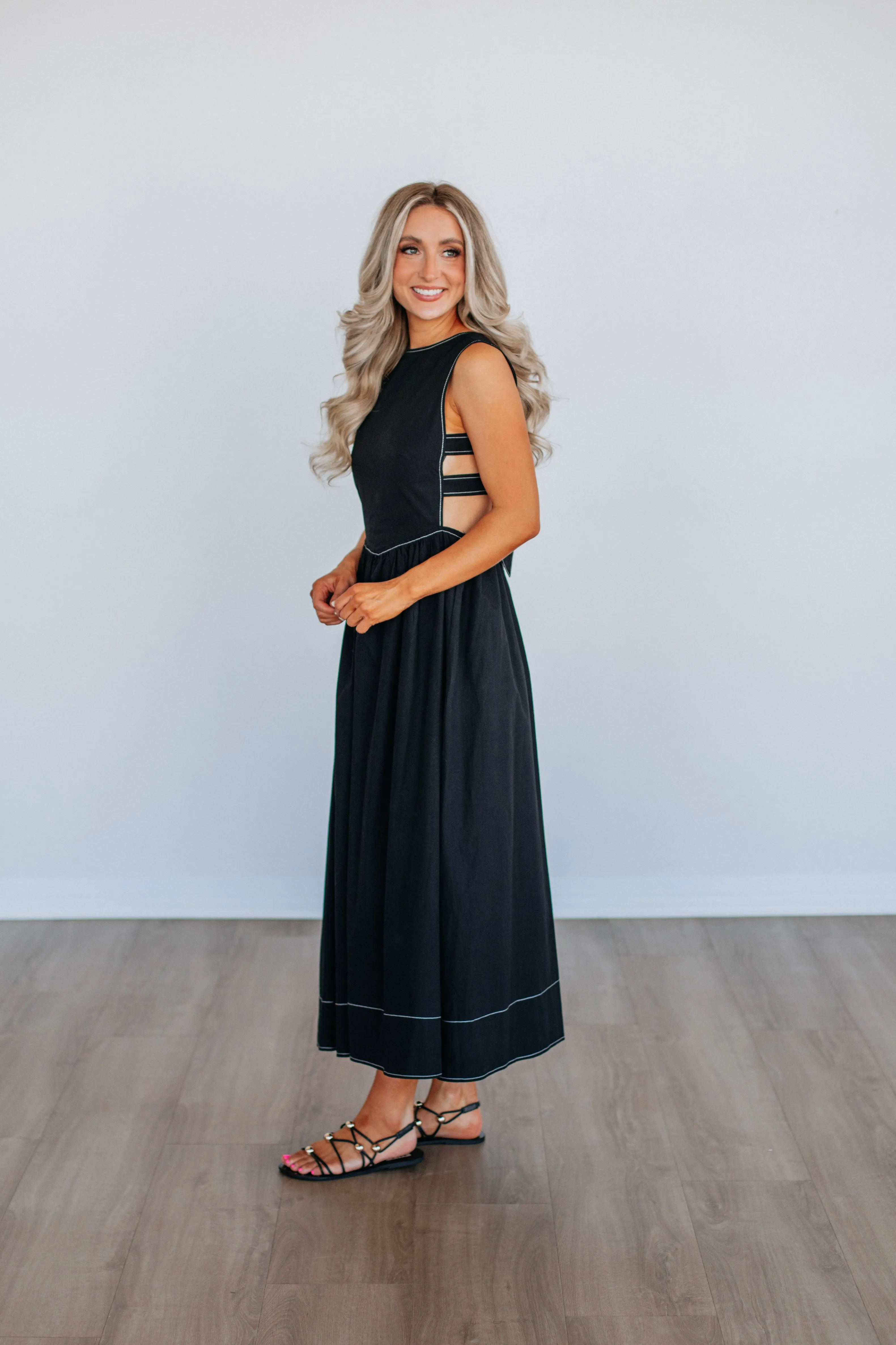 The simple yet refined design of this dress makes it easy to pair with different accessories Alicyn Dress - Black