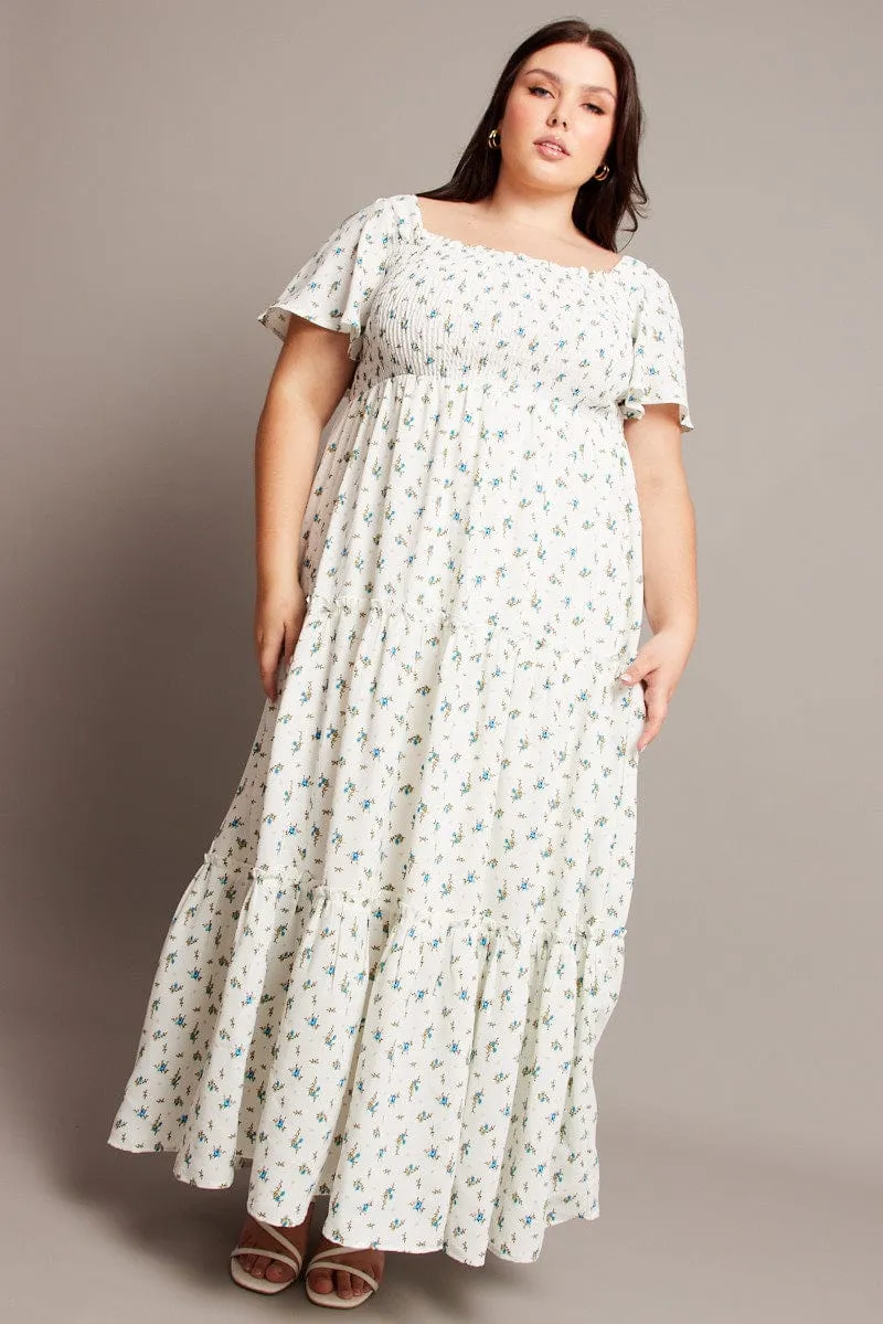 Travel Easy Perfect for warmer months this dress provides a light and breezy fit without sacrificing style Blue Ditsy Maxi Dress Short Sleeve Shirred