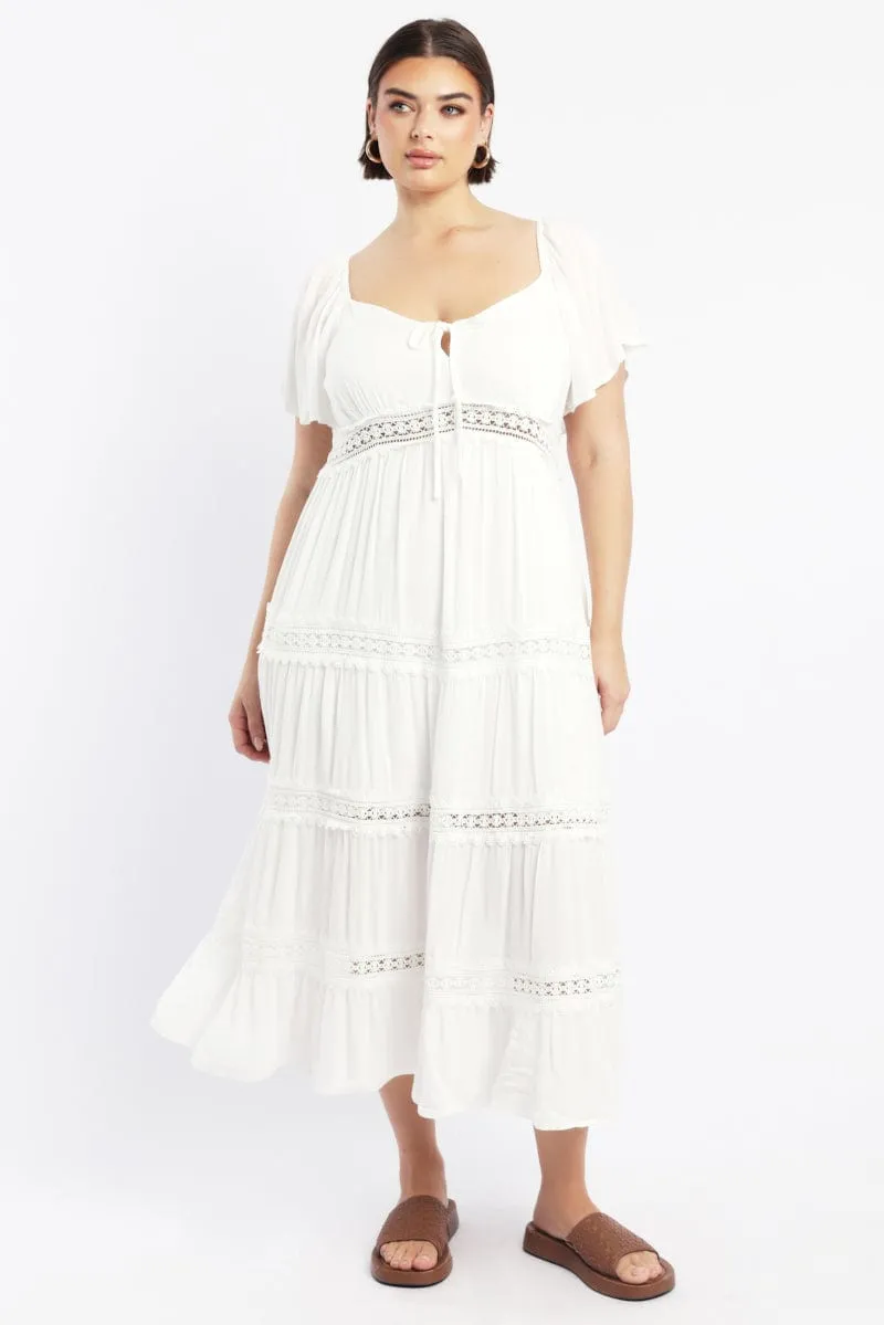 White Maxi Dress Short Sleeve Tiered Crochet Designed with simplicity and sophistication in mind this dress is perfect for any occasion