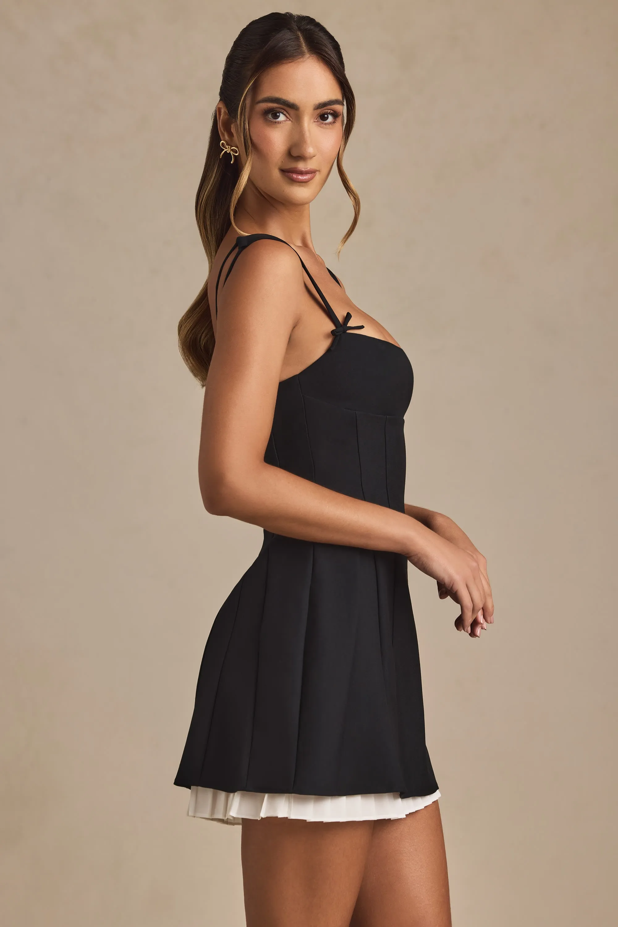 playful mini Bow-Detail Pleated A-Line Mini Dress in Black