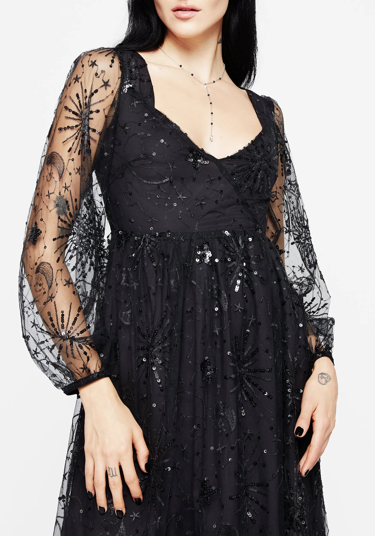 Sirius Sequined Faux Wrap Maxi Gown Retro Mode This dress is perfect for transitioning between seasons while still maintaining an elegant look