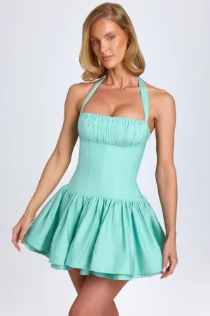 Light Reflective Seam Free Edges Ruched Halterneck Mini Dress in Sea Green