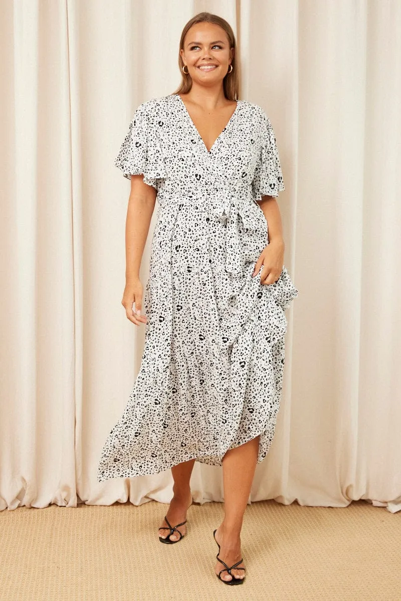 White Animal Print Maxi Dress Short Sleeve Wrap Front Tiered Patch Glow This dress is perfect for transitioning between seasons while still maintaining an elegant look