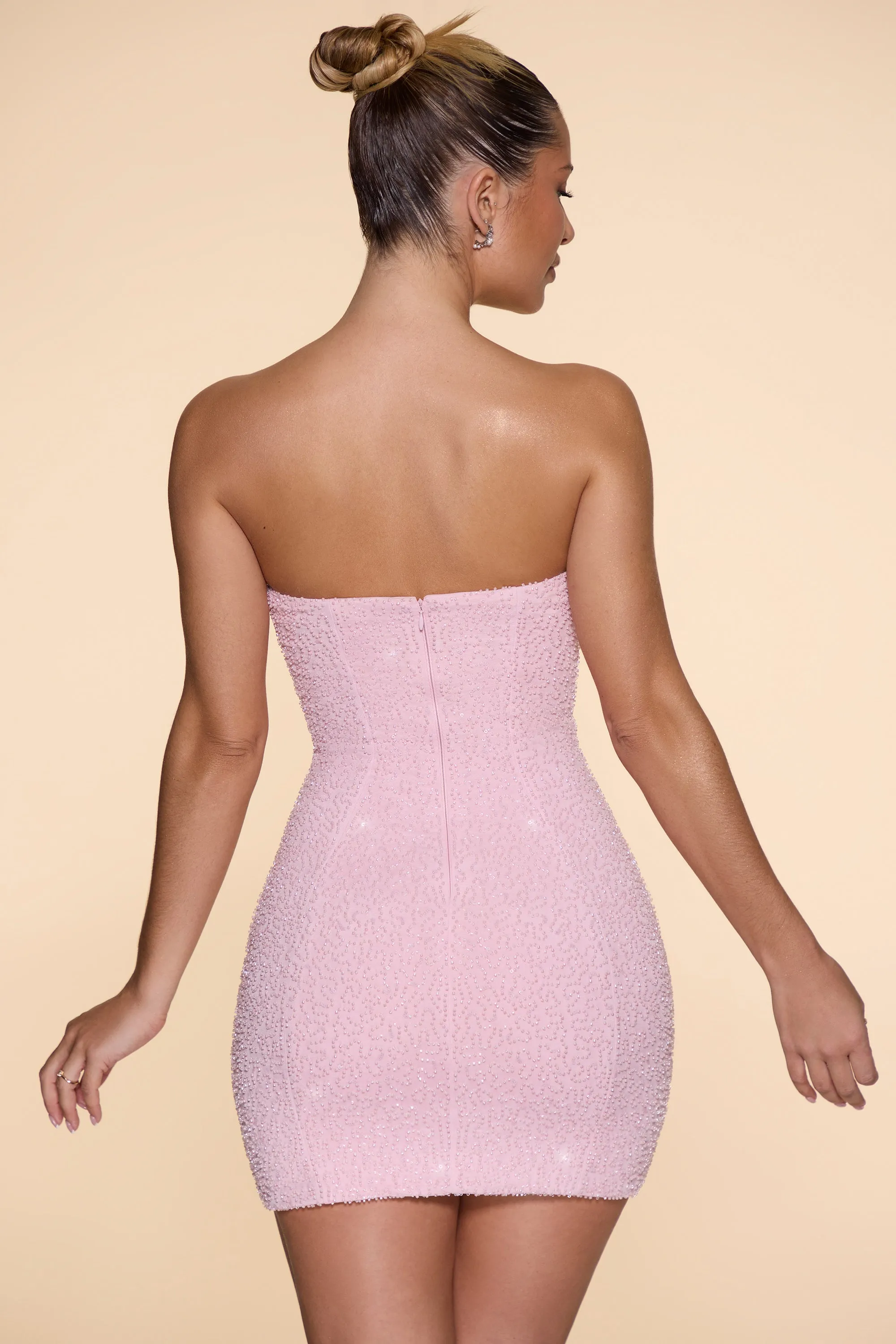 Stretchable Fit Glow Heat Embellished Strapless Cowl Neck Mini Dress in Blush
