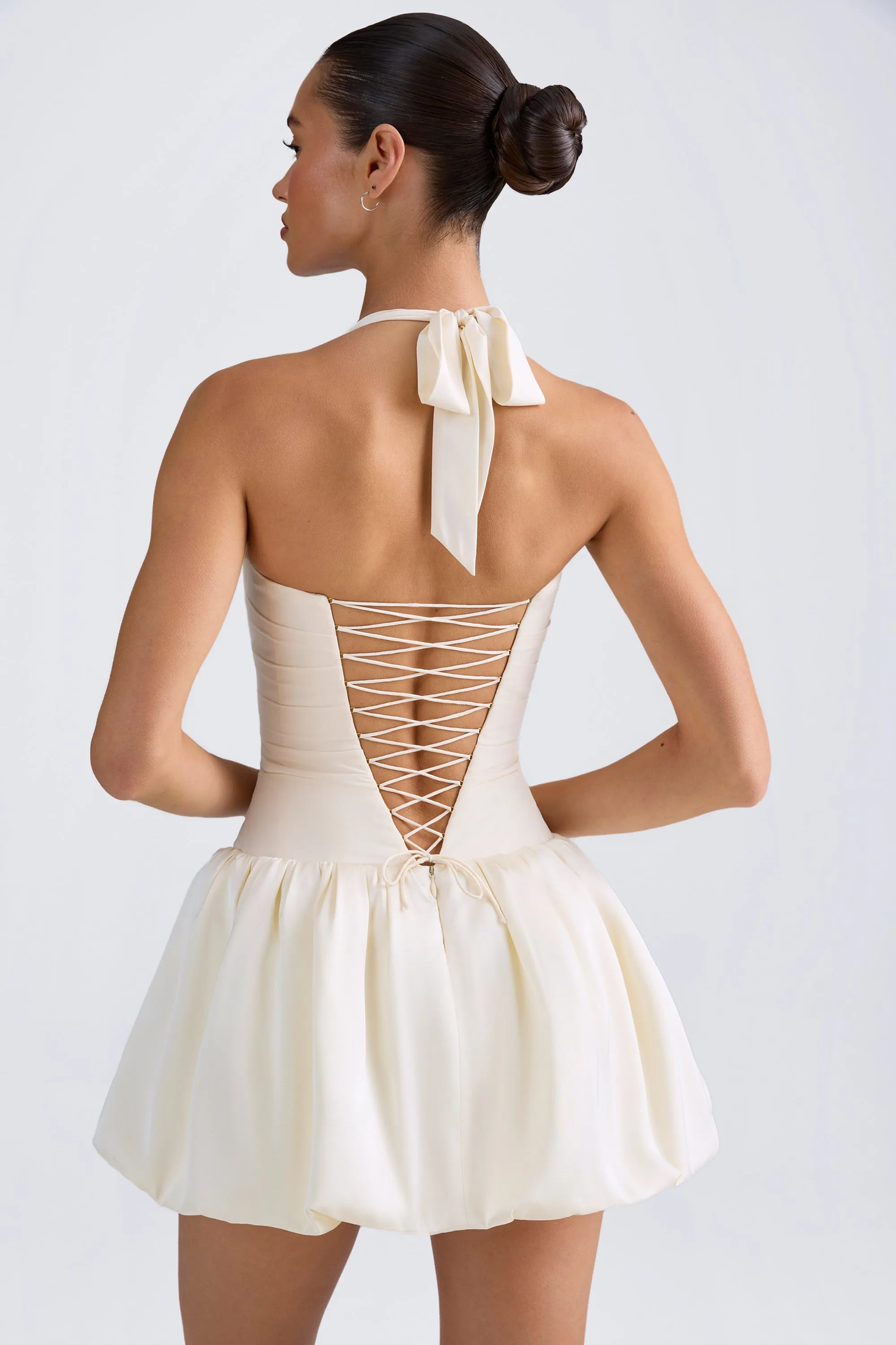 Urban Fashion Halterneck Lace-Up Bubble Hem Corset Micro Mini Dress in Ivory