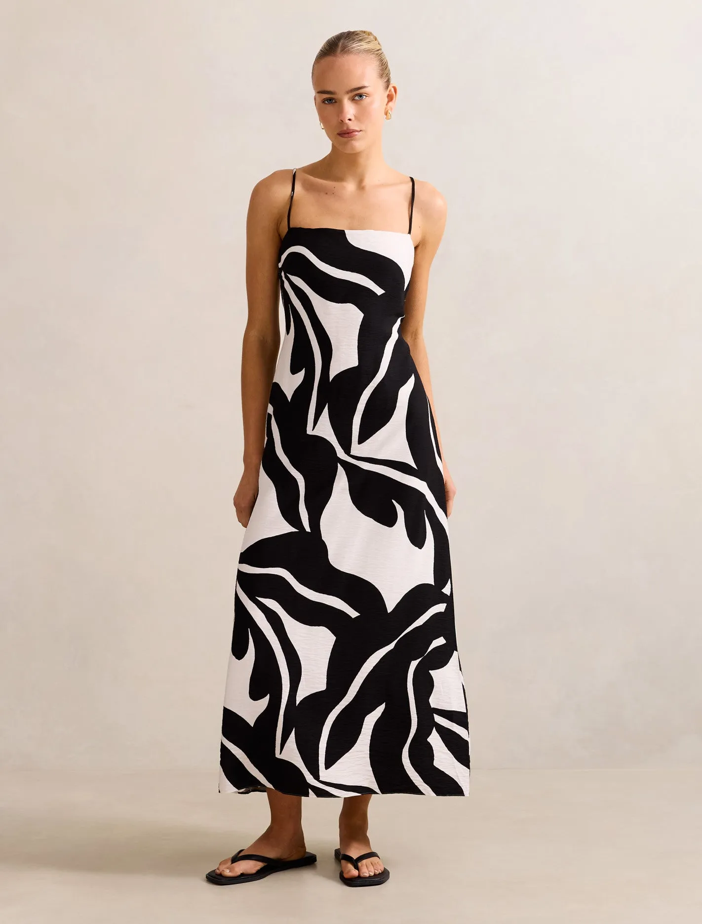 Minimalist long piece This maxi dress offers a comfortable and flattering fit for any occasion Anella Textured Tie Back Maxi Dress